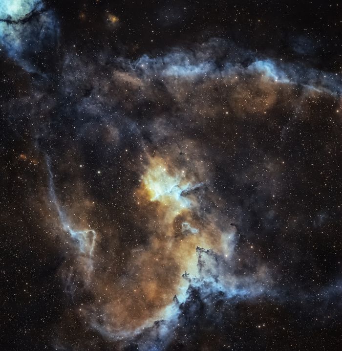 Explore the mesmerizing colors and patterns of a nebula in deep space.